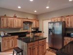 Fully stocked kitchen with center island and bar stool seating for 2